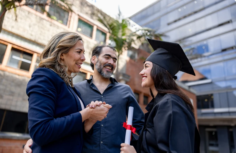Proud parents with graduating daughter